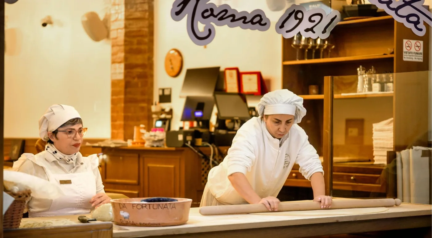 Chef preparing fresh pasta in a Bologna kitchen