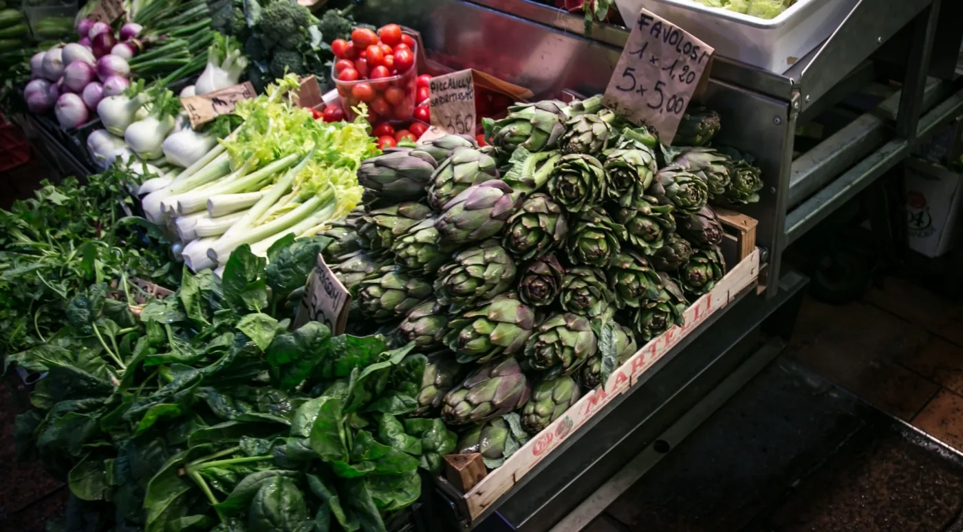 Colourful produce at a Bologna market greengrocer